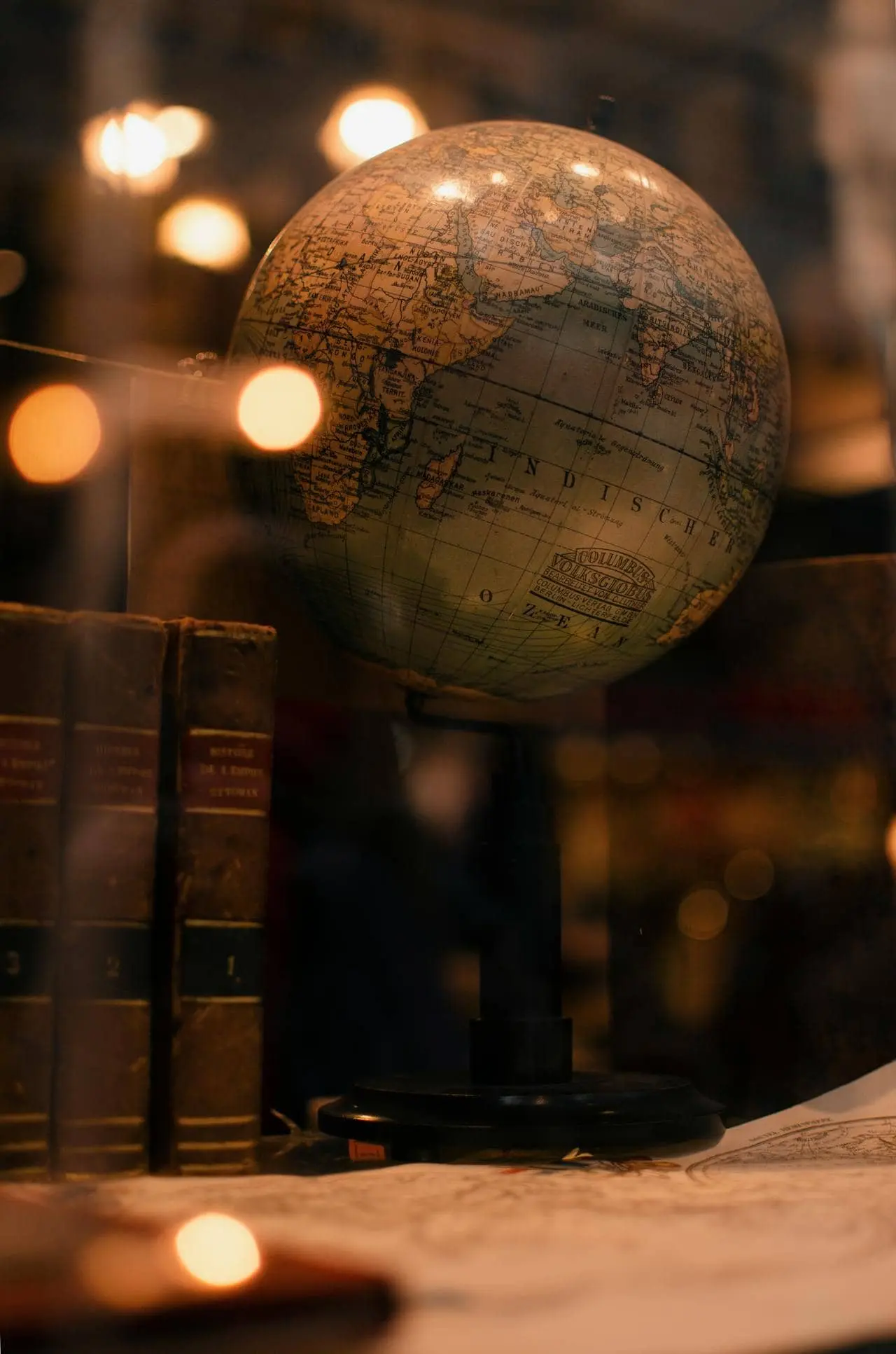 globe with old books on a desk